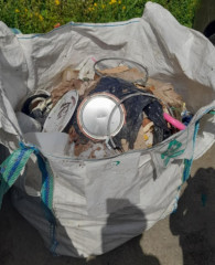 Tonne white bag filled with mixed waste