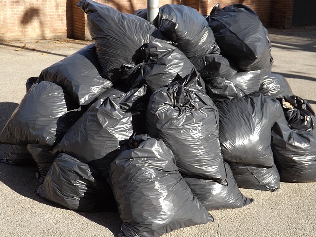 Large pile of black rubbish bags